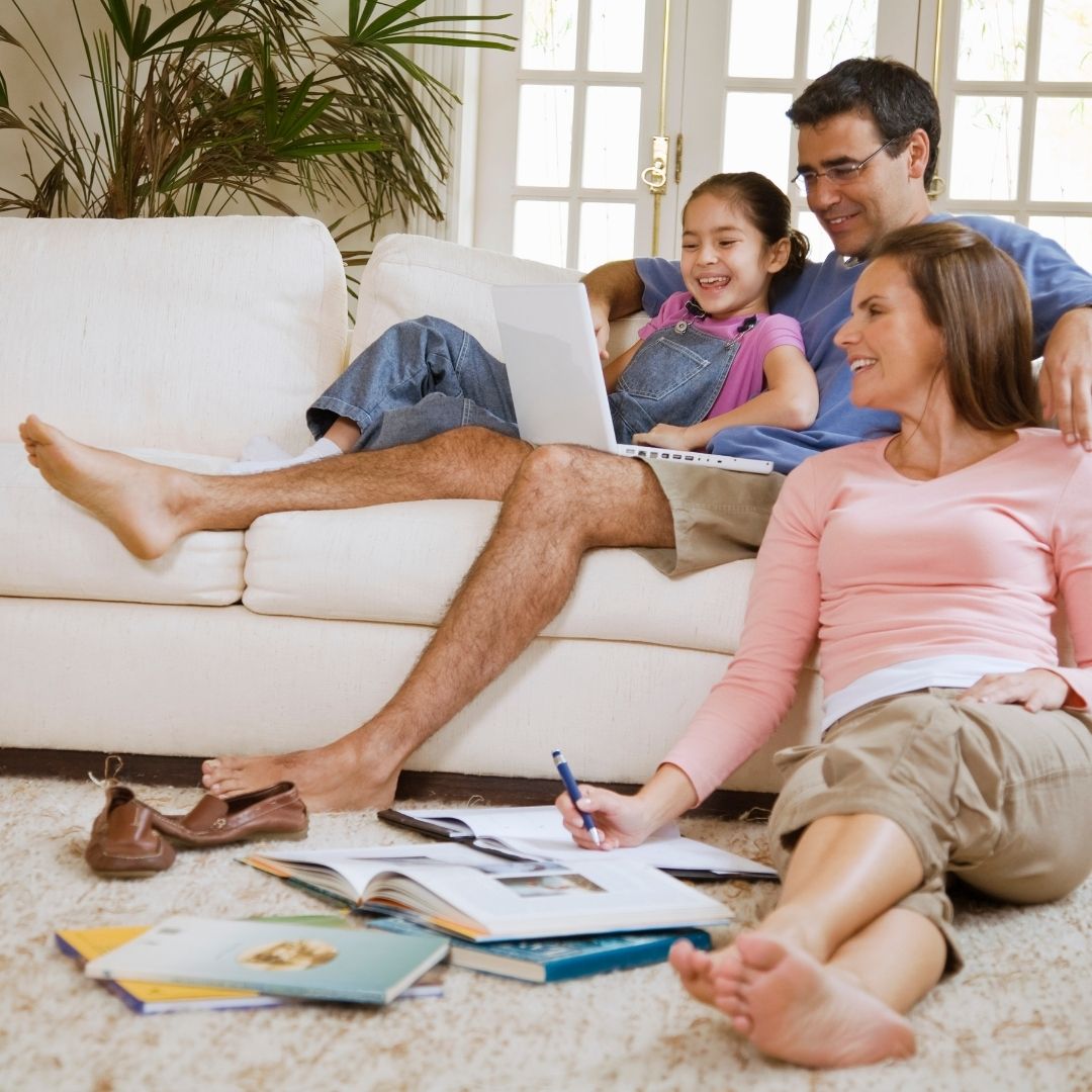 family on couch and floor