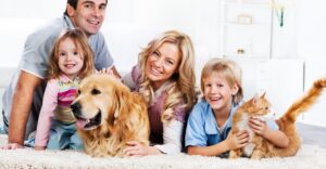 family with dog on floor