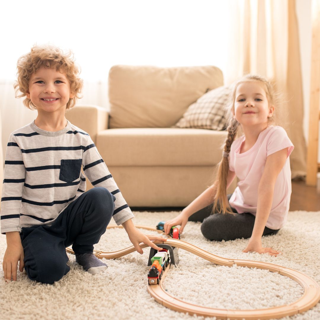 kids playing on a fluffy rug