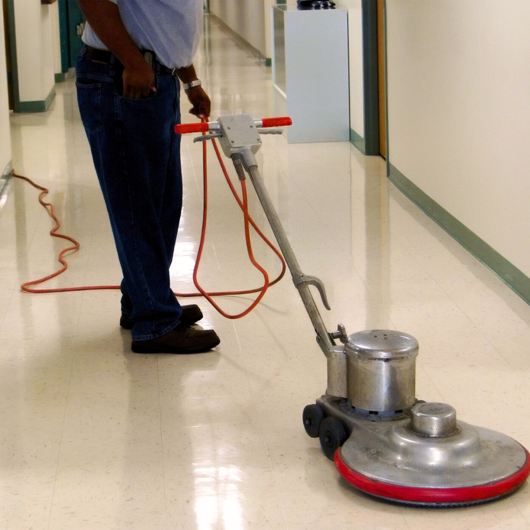 man waxing tile floor