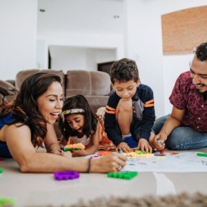 family coloring sitting on carpet